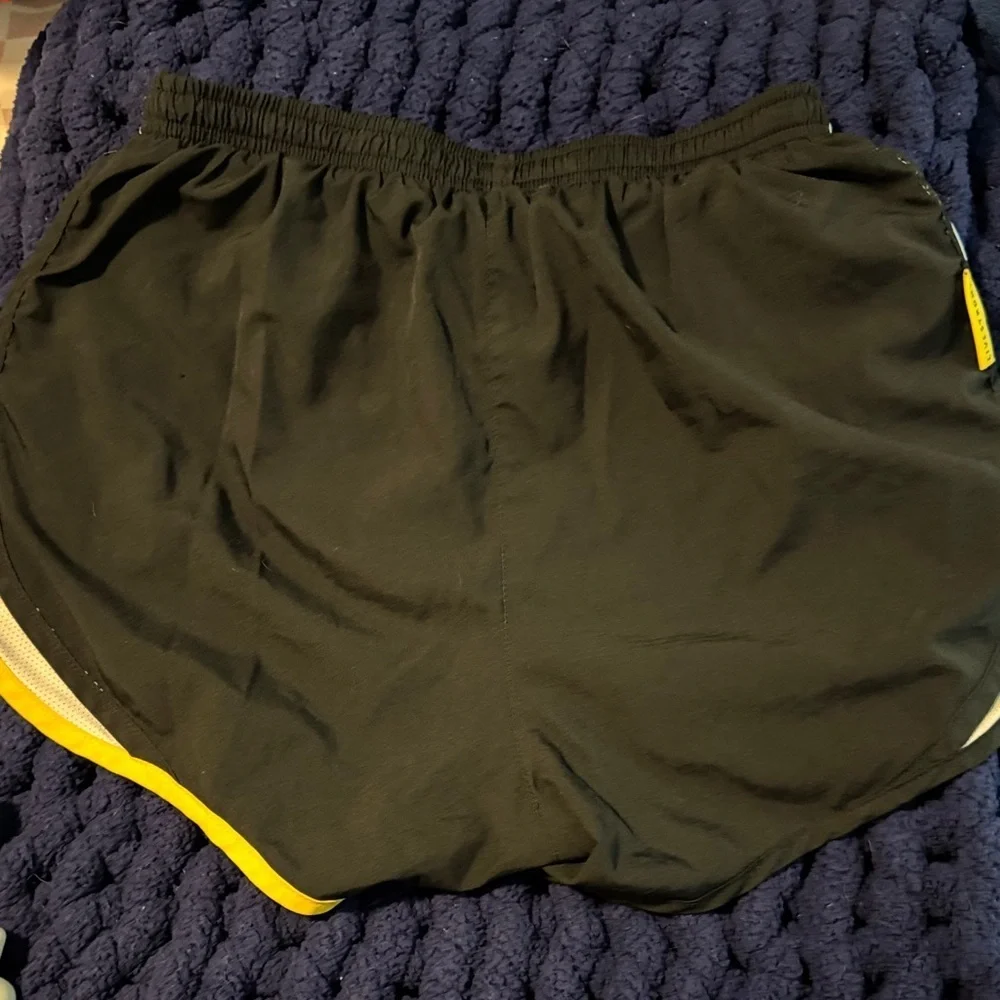 Nike Women's Black Shorts with Yellow and White Accents